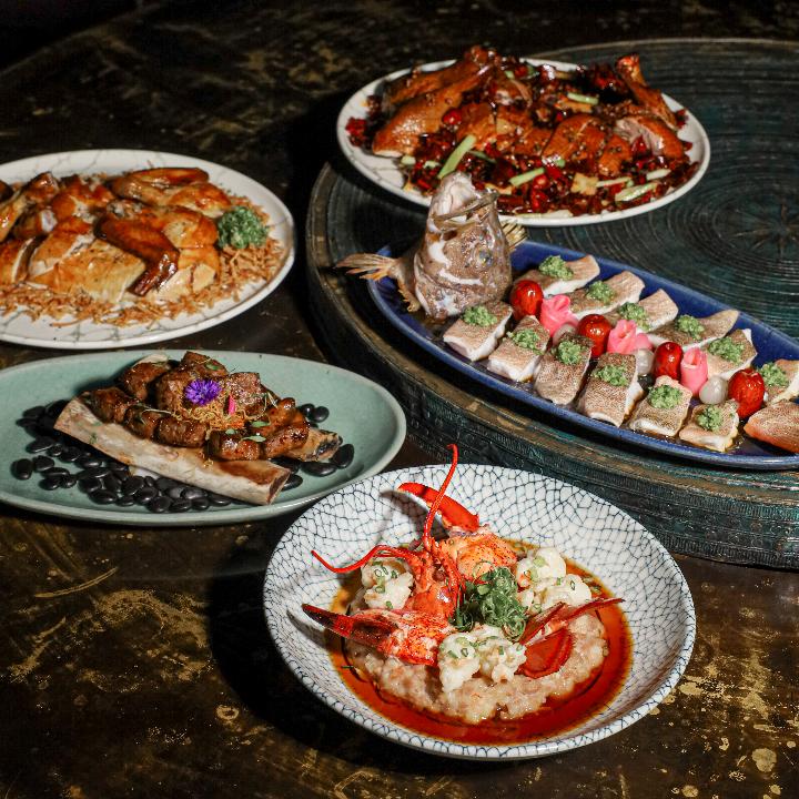 A group of plates of food

AI-generated content may be incorrect.